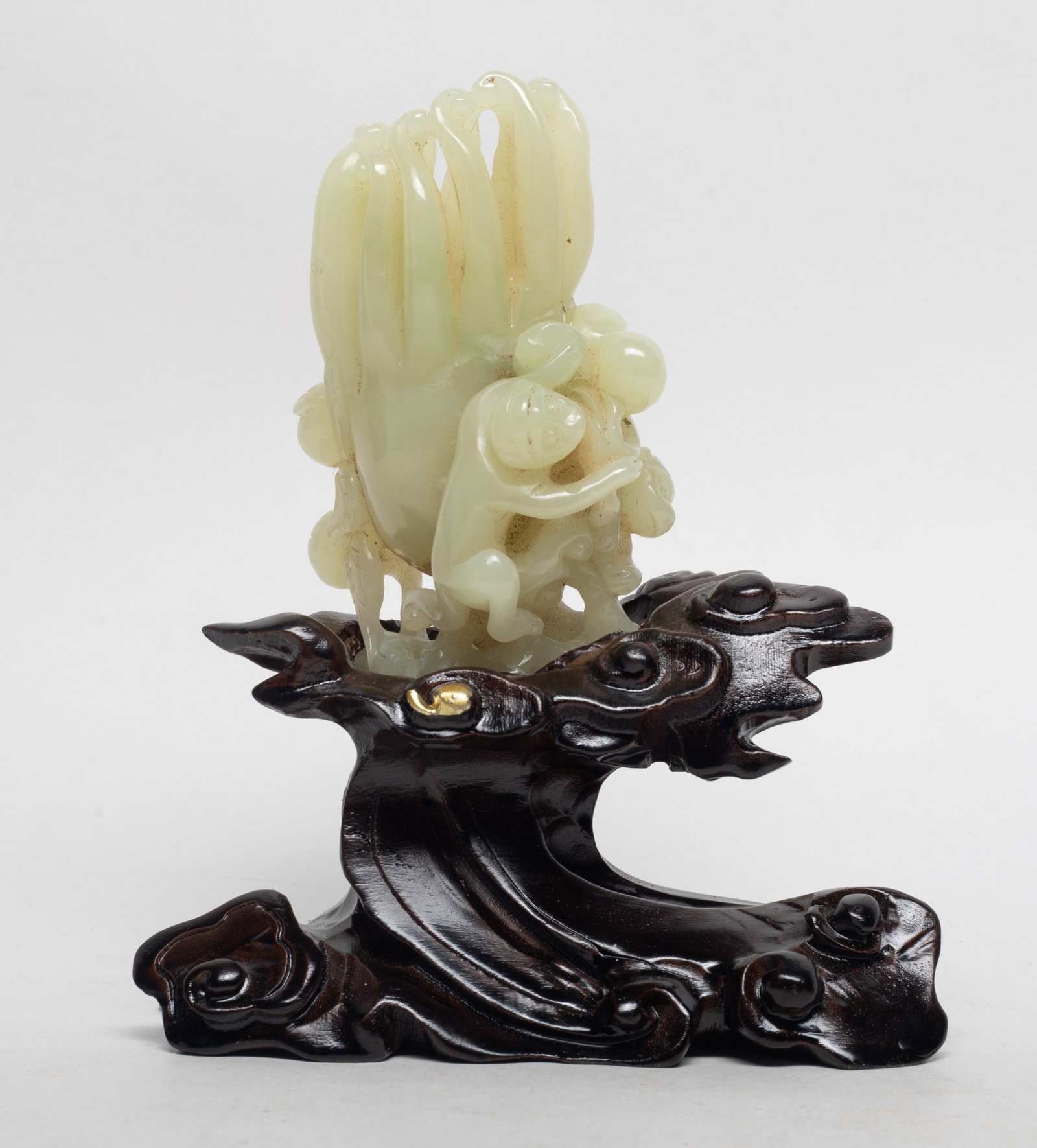 Chinese Jade Buddha Hand on Base: Chinese jade buddha hand citron sculpture, carved with monkeys clambering on stems issuing peaches and pomegranates, with stand. Approx. 3.9*2.7*2.1 inch (w/o stand).