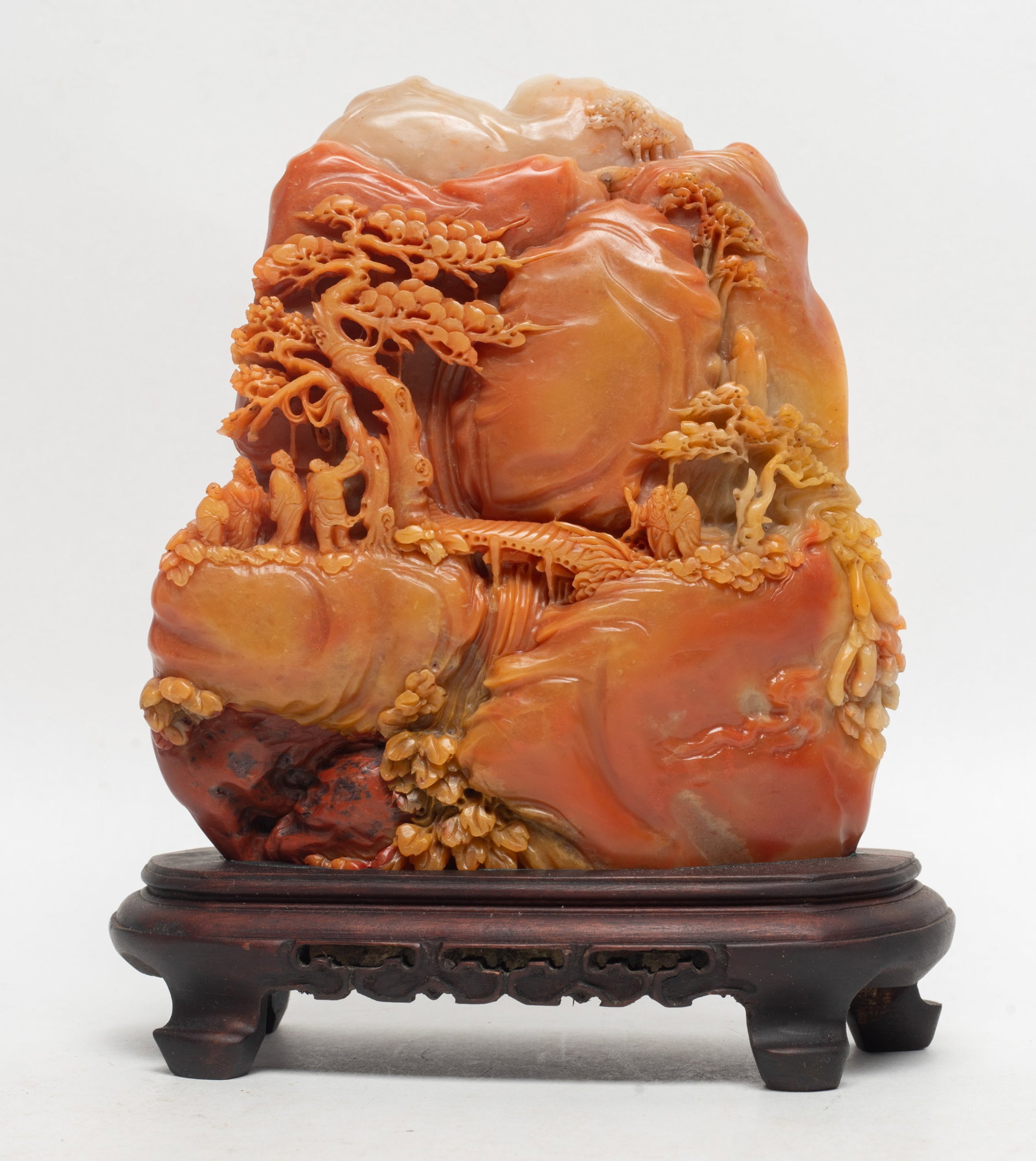 Vintage Chinese Shoushan Stone Sculpture: Vintage Chinese shoushan stone sculpture, carved in the mountain form, detailed with multiple layers of figures and pine tree scene, with a fitted wood stand. Approx. 5.2*6.1 inch (w/o stand).