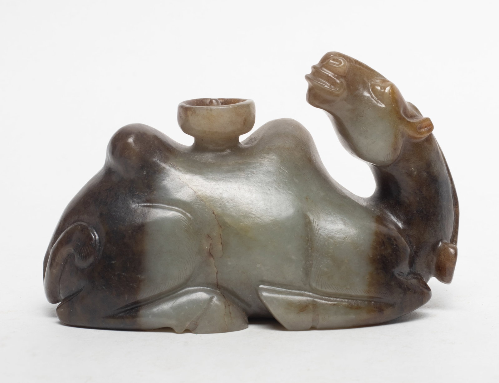 Large Chinese Russet Jade Sculpture: Chinese russet jade sculpture carved of recumbent camel form. Approx. 4.7*2.9*2.2 inch.
