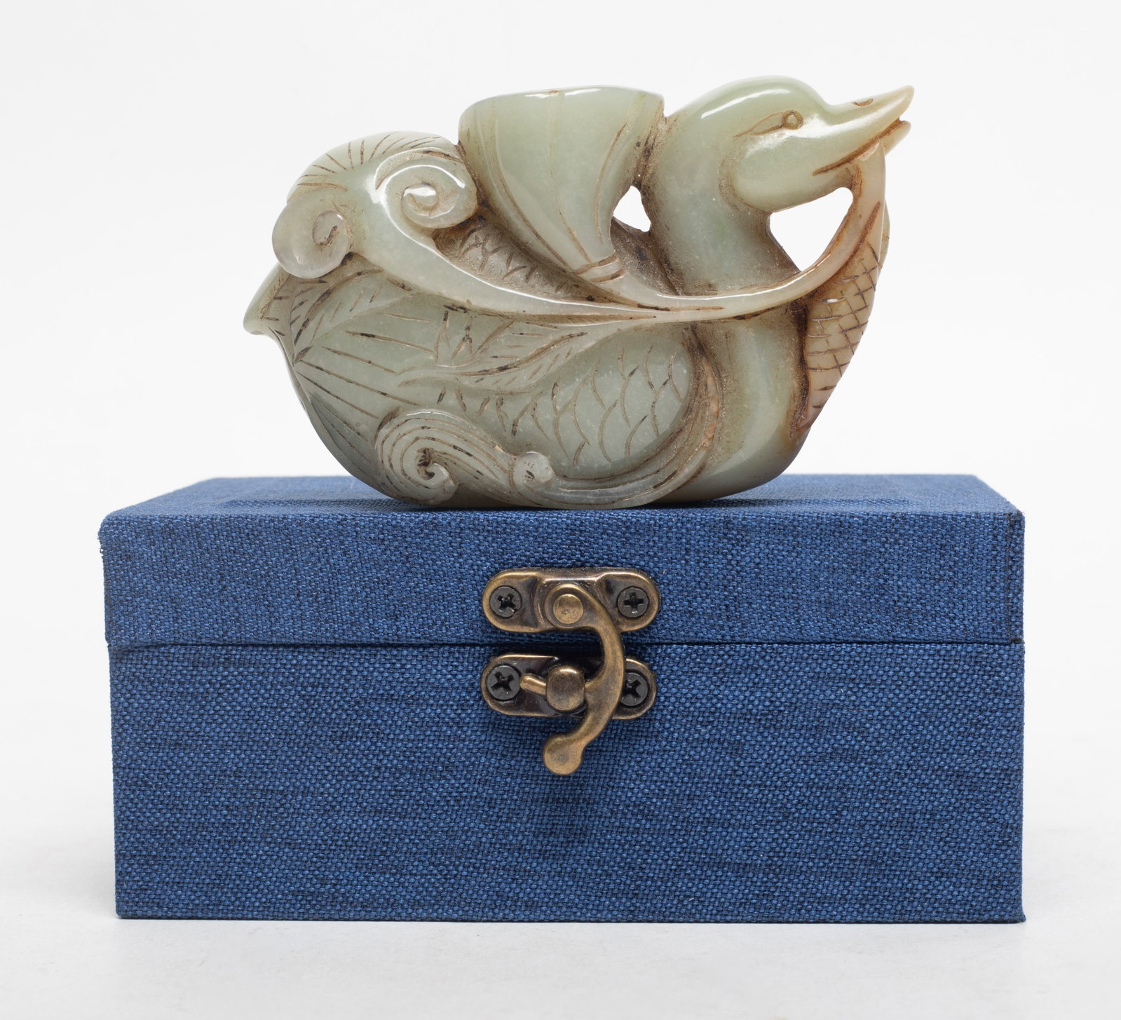 Chinese Jade Carved Pendant w/ Box: Large Chinese jade pendant carved as duck grasping lotus seedpod and lingzhi stem in mouth, with box. Approx. 3.65*2.2*1 inch (jade size).