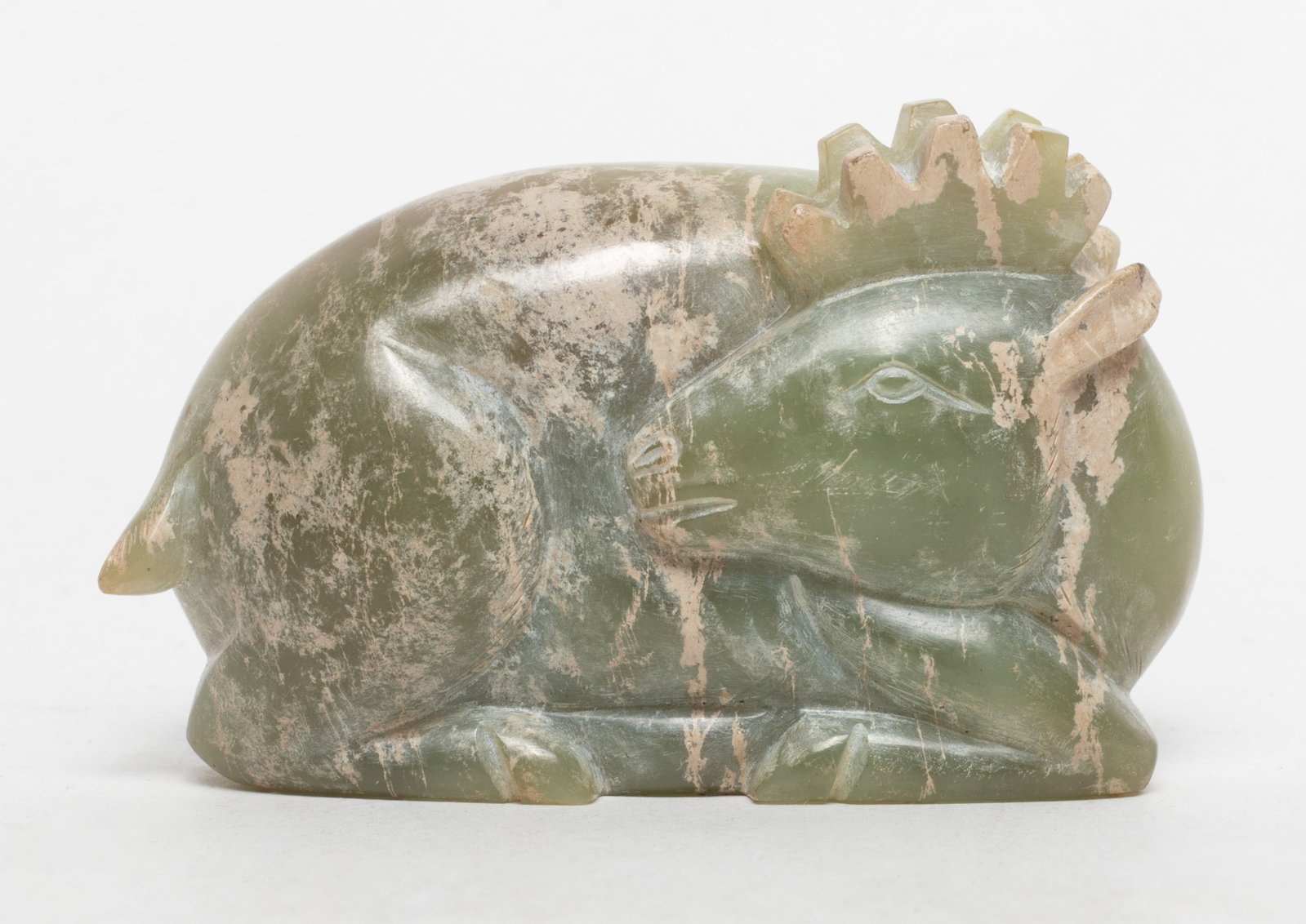 Rare Chinese Russet Jade Pendant: Chinese russet jade carved recumbent stylized buffalo sculpture. Approx. 3.2*1.97*0.8 inch.