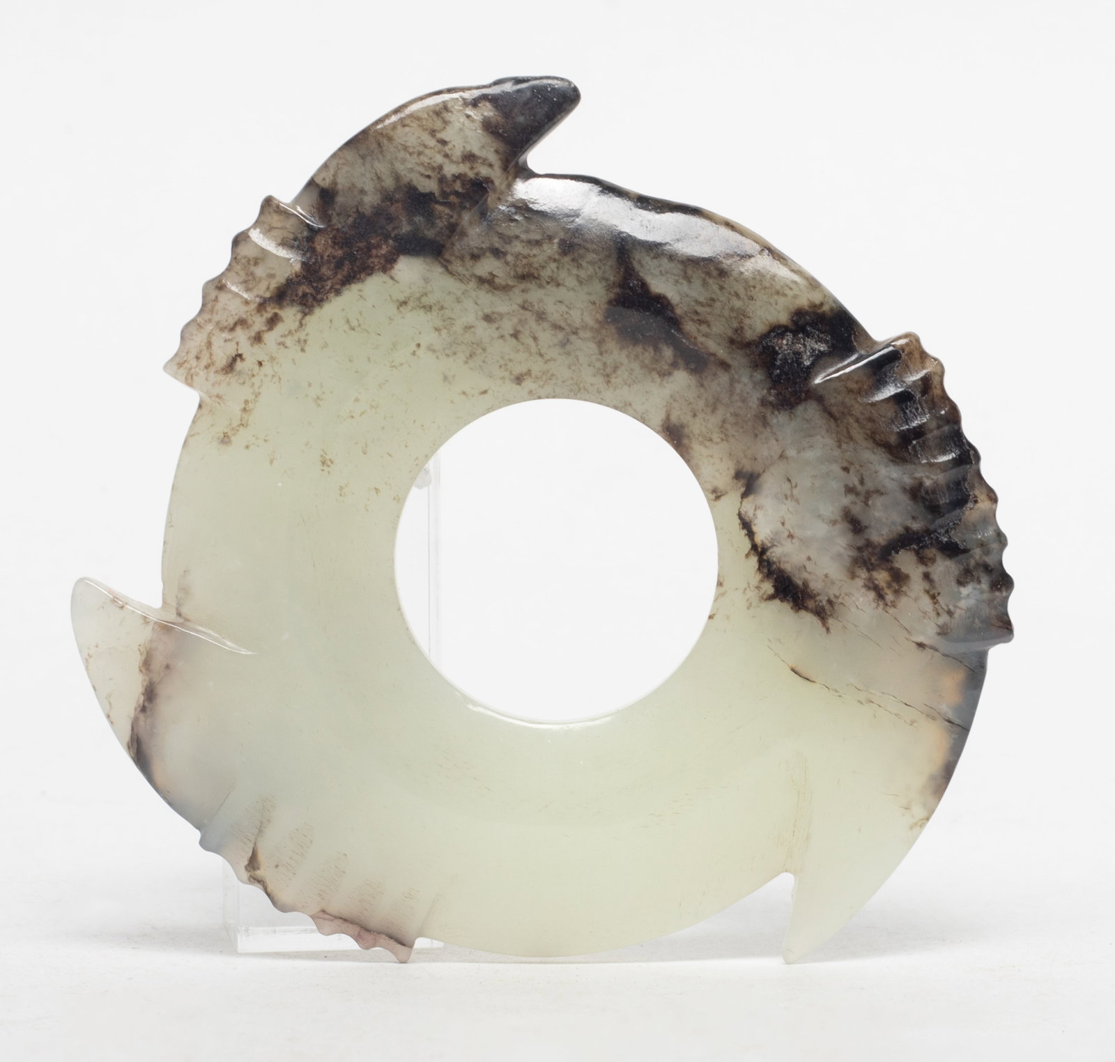 Estate Chinese Jade Carved Pendant: Chinese white and black jade carved archaic notched disc pendant. Approx. 3.1 inch D.