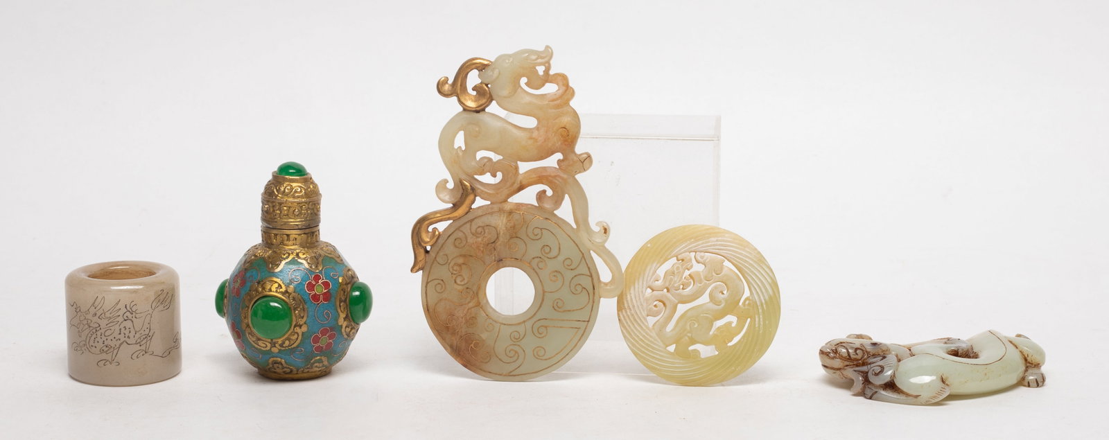 Set Chinese Jade, Stone, Brass Decors: Including a thumb ring, an enameled stone bottle, and three jade / stone carvings. Approx. 4.6*2.9 inch (largest).