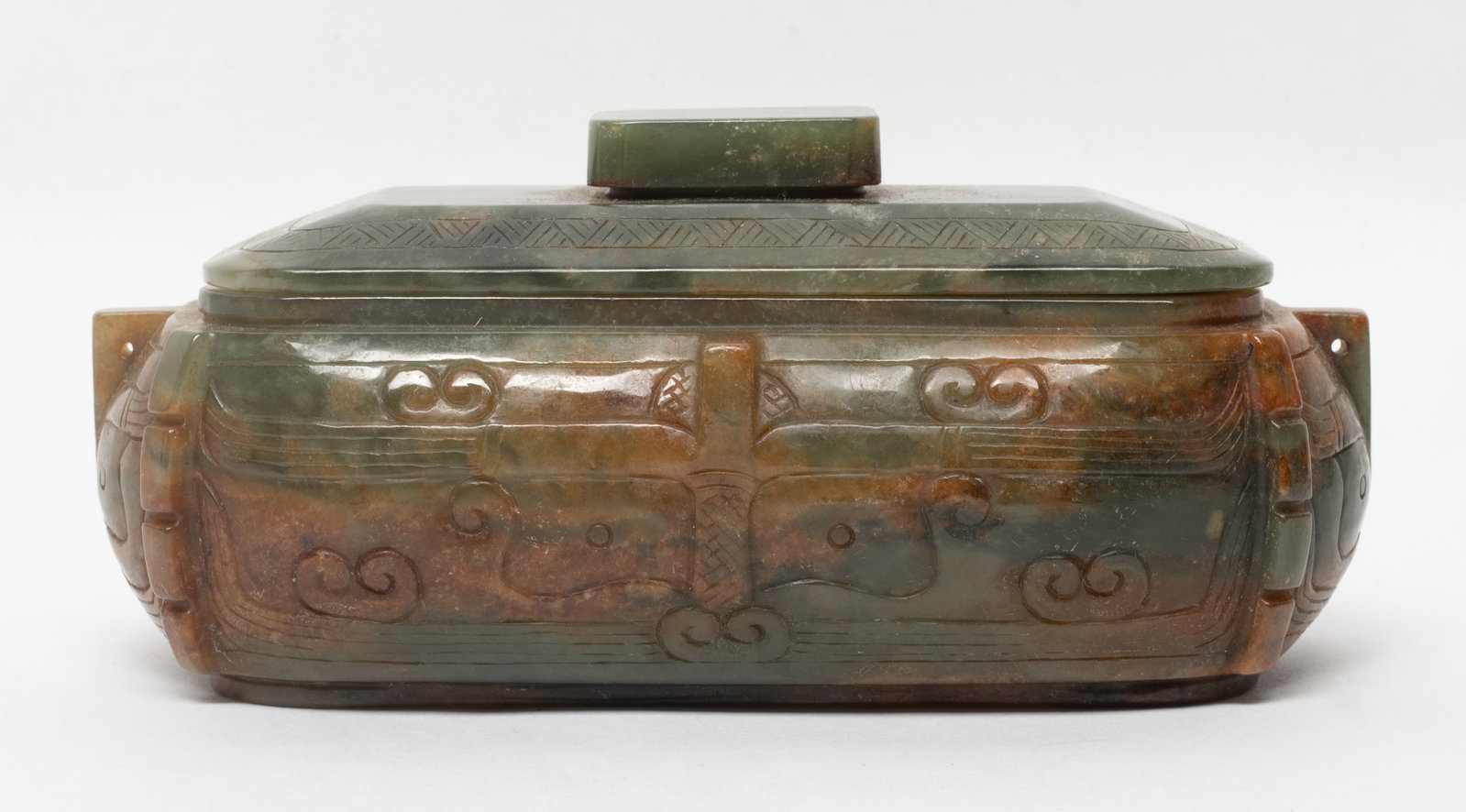 Chinese Jade/ Hard Stone Covered Censer: The censer styled with a rectangular body, raised horizontal flanges, and a fitted cover topped with a rectangular finial knob, applied overall in brownish-green tone. Approx. 6.2*3 inch