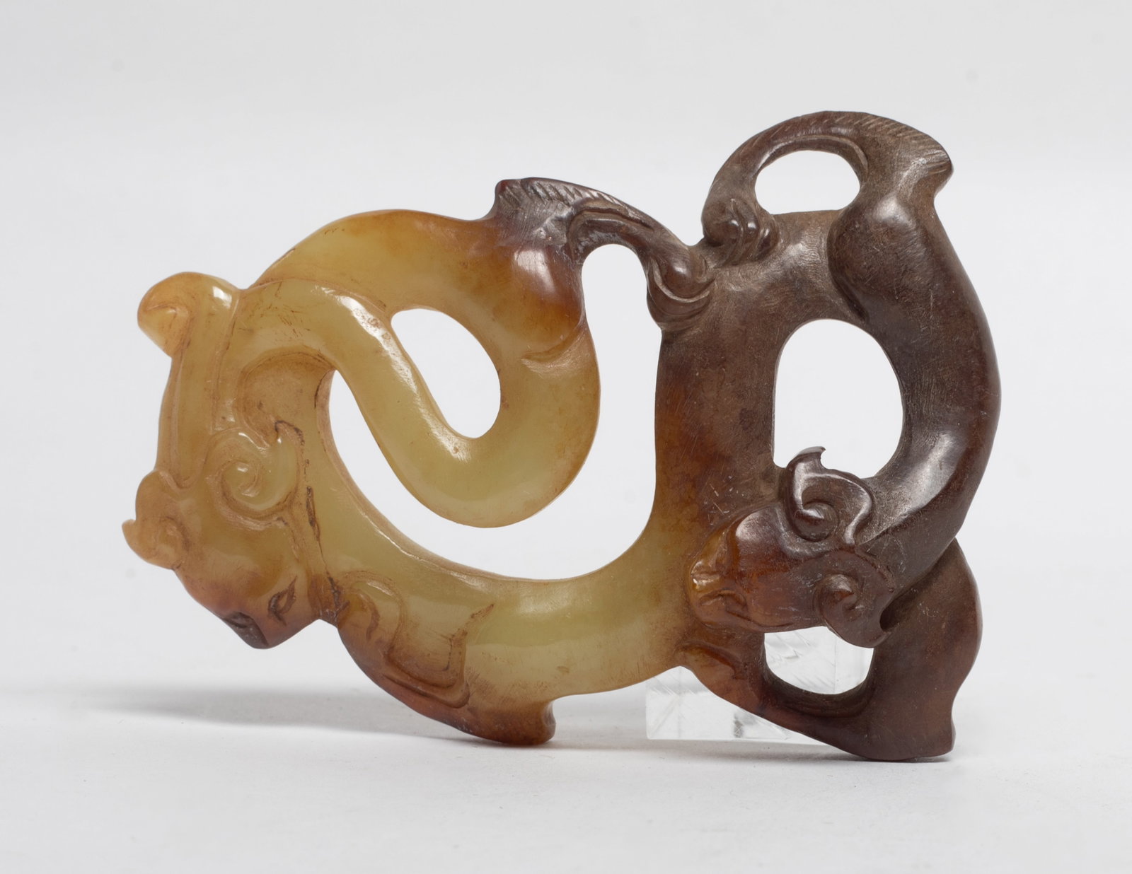 Chinese Russet Jade/ Stone Carved Pendant: Chinese russet jade/stone pendant carved with coiled dragon form. Approx. 3.22*2.37 inch
