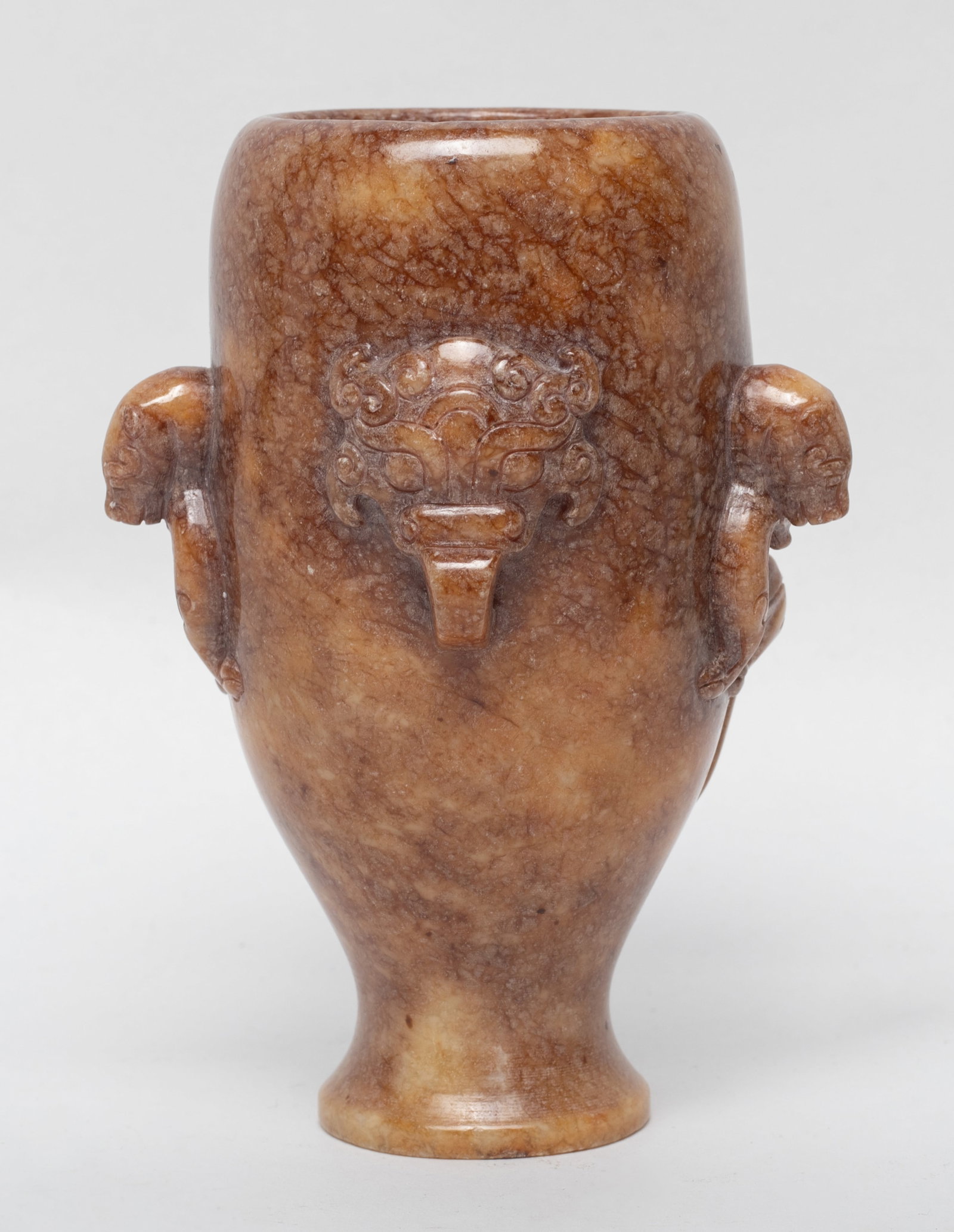 Chinese Jade/ Stone Carved Libation Cup: Tall Chinese jade/stone cup carved in high relief of two beast surmounted by the body. Approx. 4.78*3.37*2.44 inch
