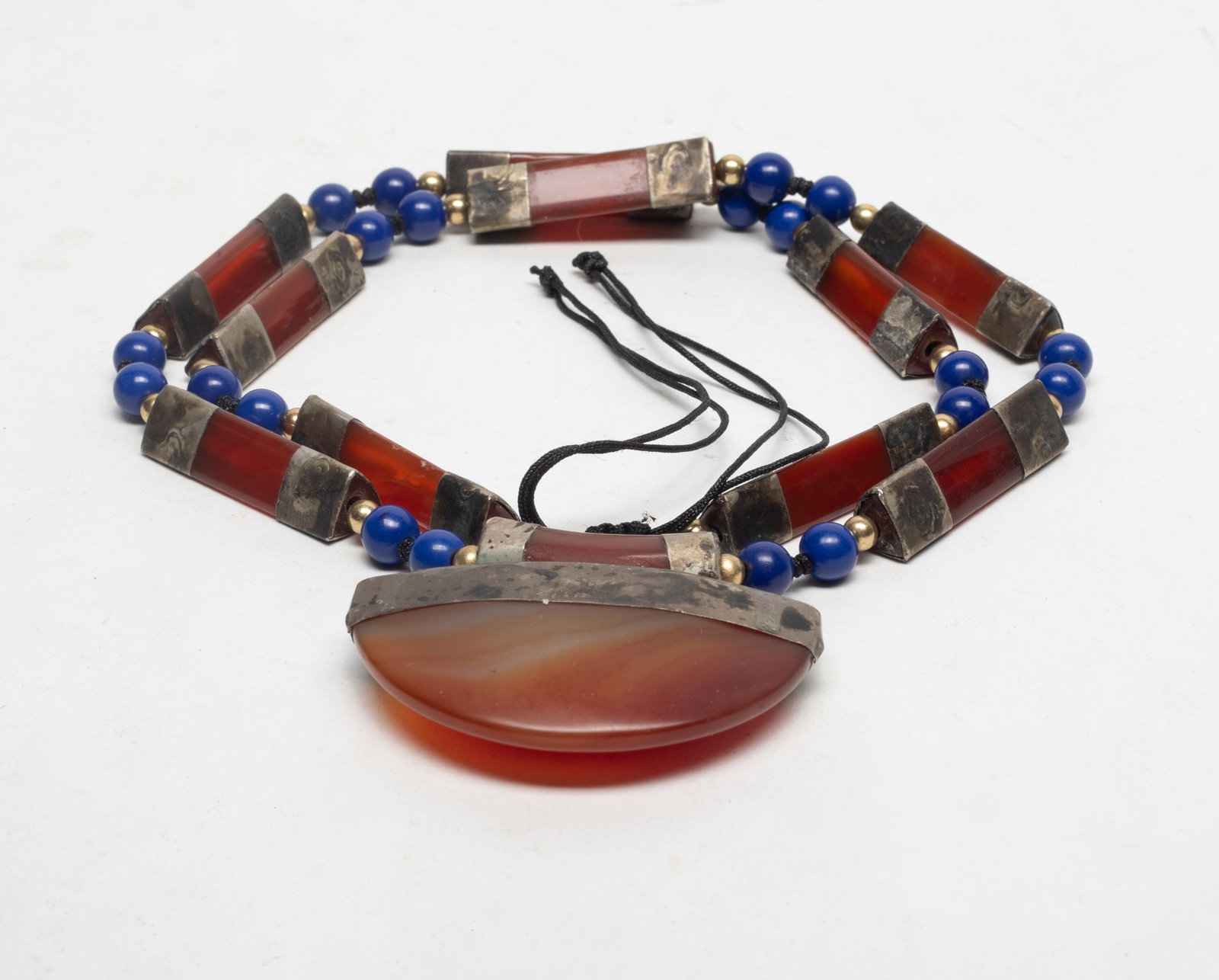 Long West Asian Cameo Agate, Lapis Necklace: West Asian type designed cameo agate and lapis carved necklace. Approx. 27 inch L.