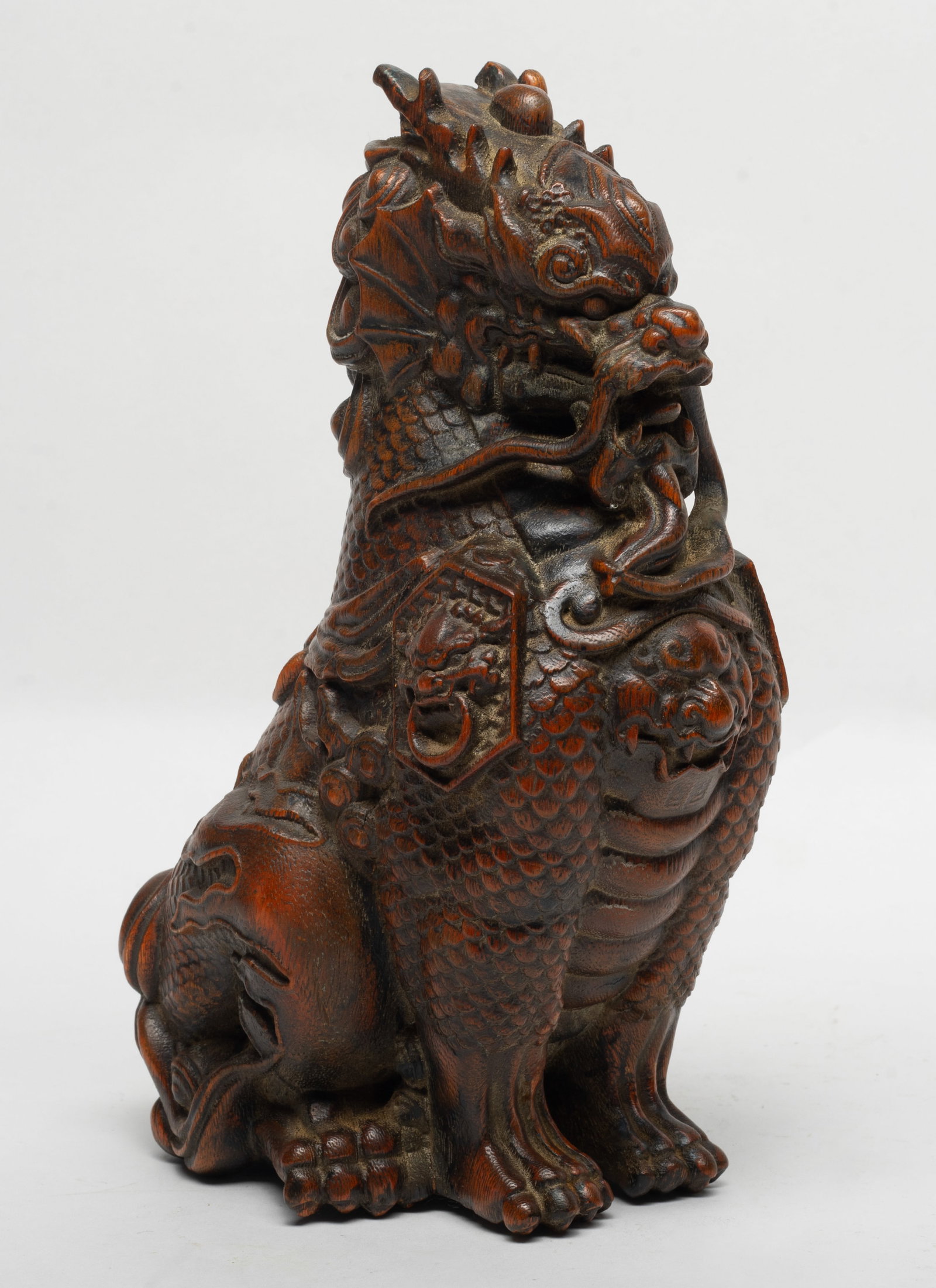 Estate Chinese Wood Carved Sculpture: Carved in the form of the beast statue in a seated position, detailed with bulging eyes, flared nostrils. Approx. 9.2*4.1 inch