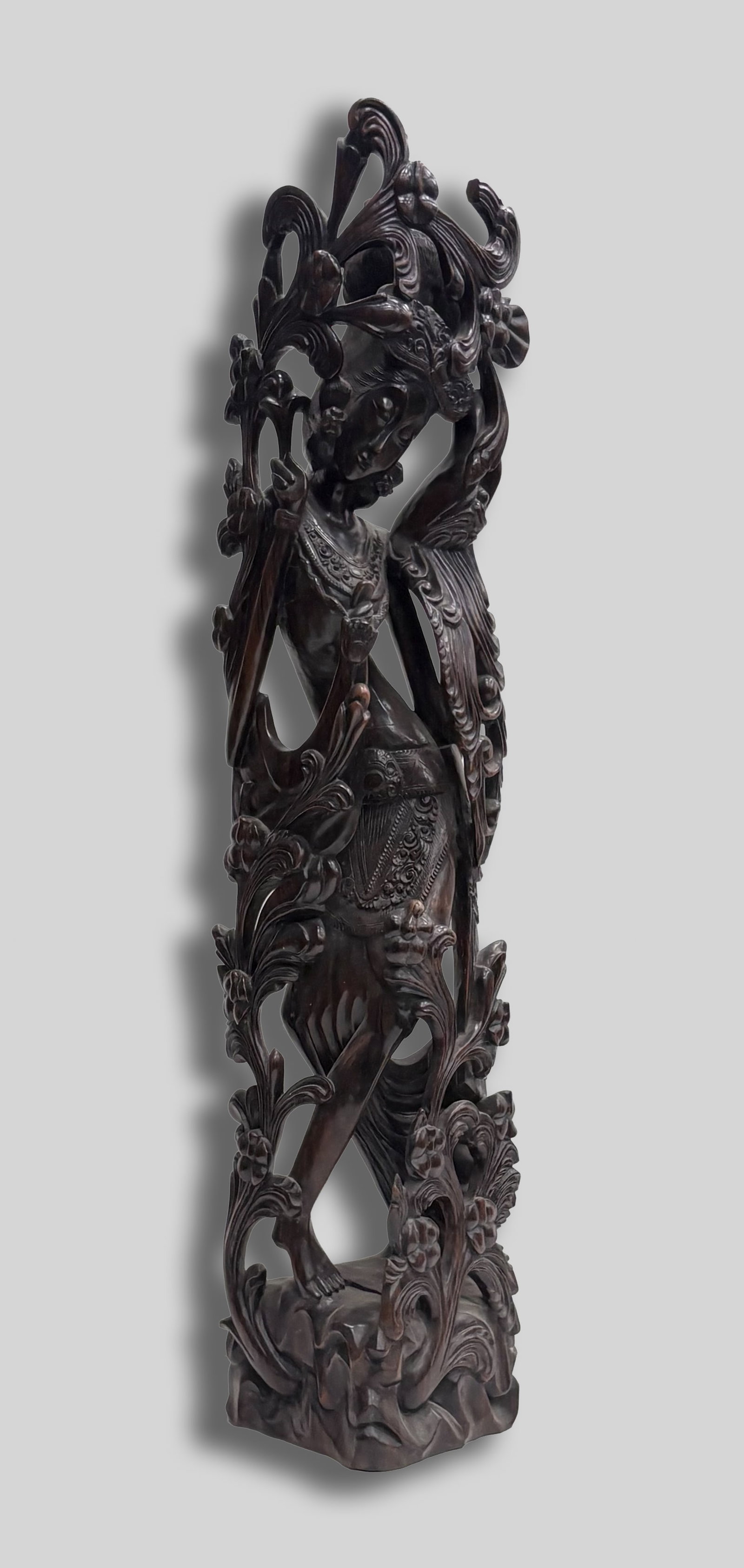 Tall South Asian Heavy Wood Sculpture: Tall heavy South Asian type wood sculpture carved in openwork as an elegant female among foliage. Approx. 39*9*6 inch.