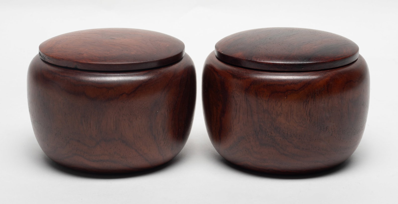 Two Chinese Wood Carved Boxes: Two well polished wood carved boxes, with a fitted cover. Approx. 5.2*3.87 inch
