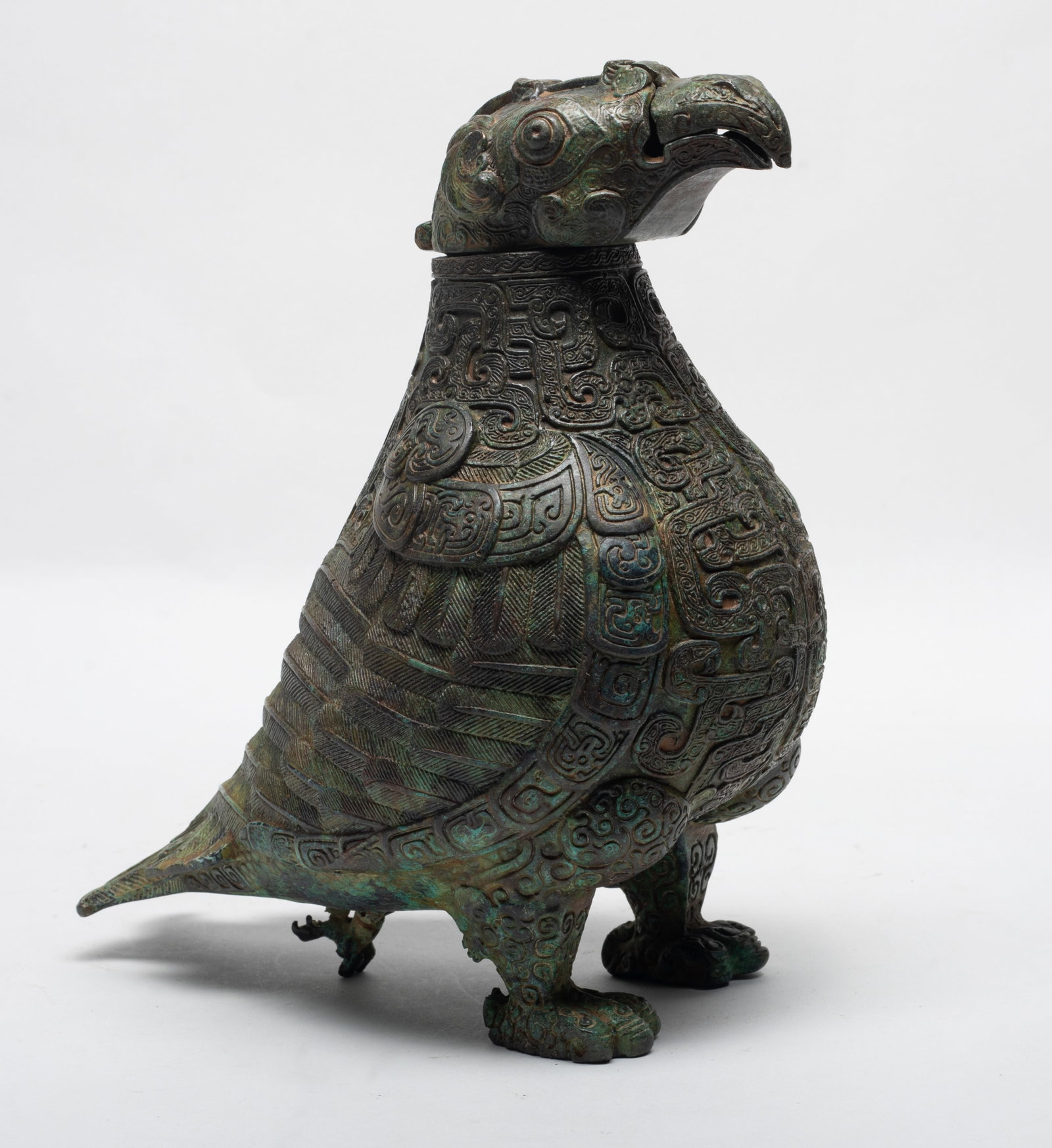 Tall Chinese Bronze Covered Vase: Tall Chinese bronze covered vase, in the form of archaic bird-form. Approx. 9.7*9.3 inch