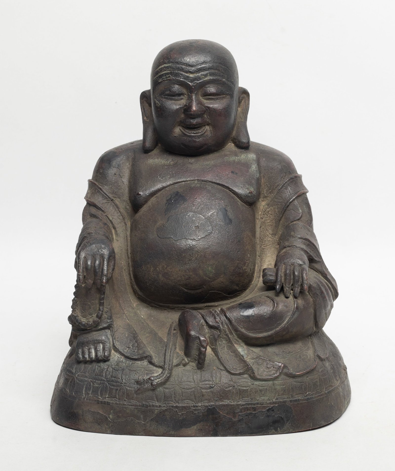 Chinese Ming Type Bronze Buddha: The Laughing buddha is well hollowed, seated with an exposed belly and loose robes, one hand holds prayer beads. Approx. 7*7.6 inch