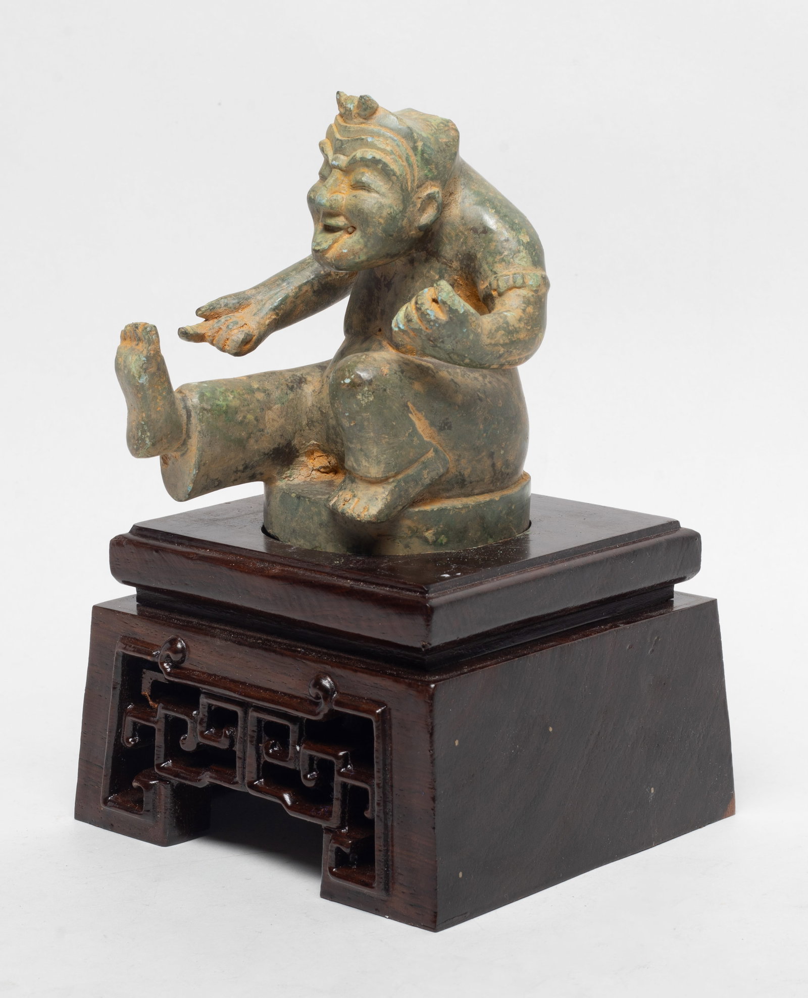 Chinese Bronze Sculpture on Wood Base: Chinese hollow bronze sculpture cast of figure form, with wood base. Approx. 4.5*4*3.6 inch (w/o base).