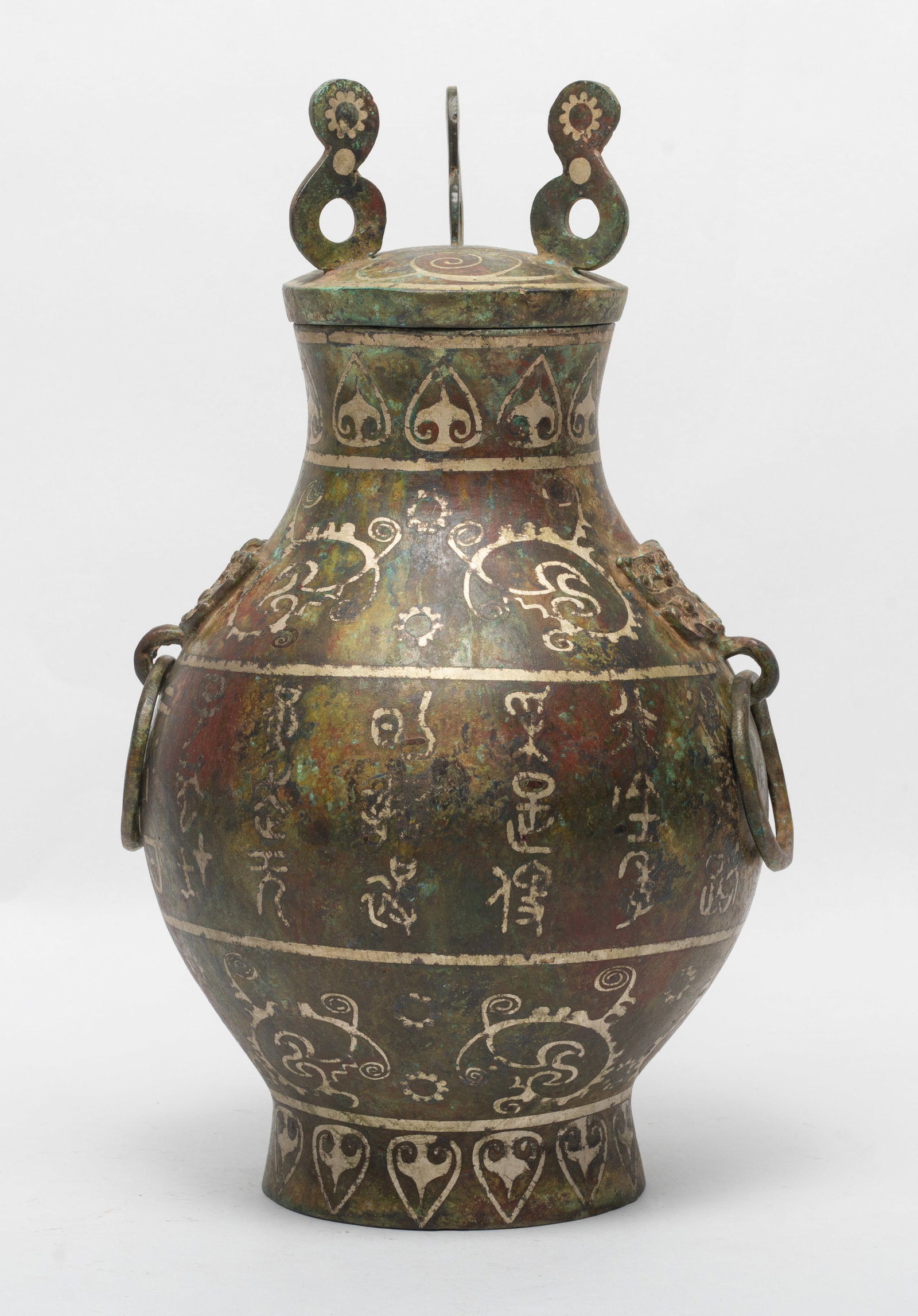 Estate Chinese Export Bronze Vase: Of ovoid form rising from a gently splayed foot to a waisted neck with flared rim, flanked with a pair of beast handles, the body carved with bands of archaistic beasts, reserved against a leiwen grou