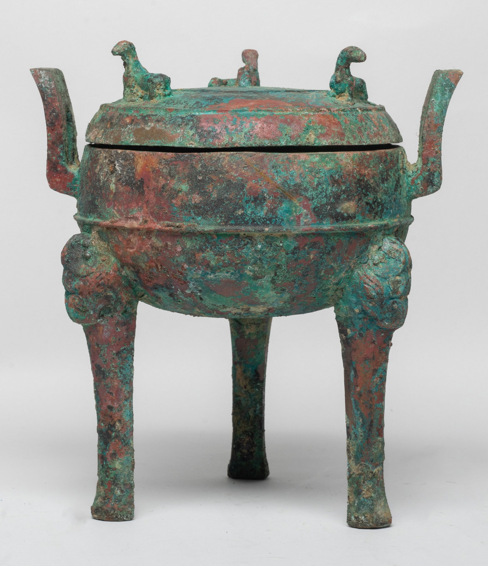 Estate Chinese Bronze Tall Censer: The censer of compressed globular form with two upright handles and three tall legs issuing from beast heads, the lid set with three beasts. Approx. 7.6*6.9*5.9 inch.