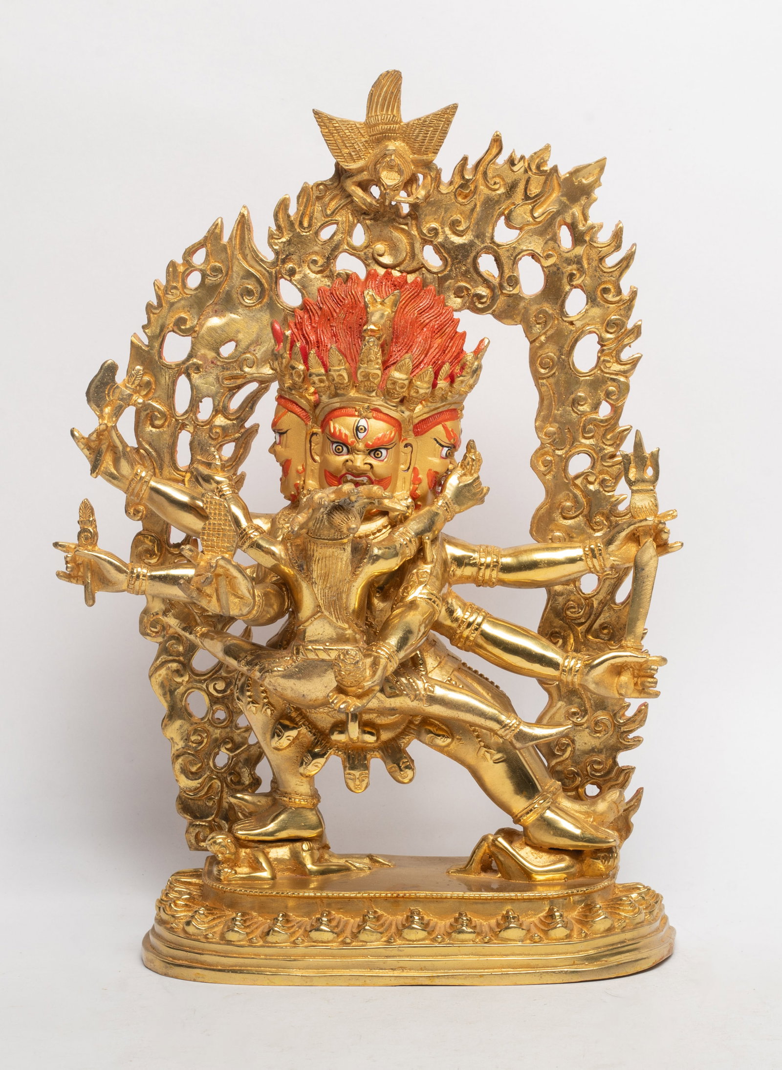 Large Chinese Gold on Bronze Sculpture of Buddha: Chinese gold on bronze Buddha sculpture, with three faces and three pairs of arms, holding an attendant Buddha in front arms. Approx. 12*8.5*3.5 inch.
