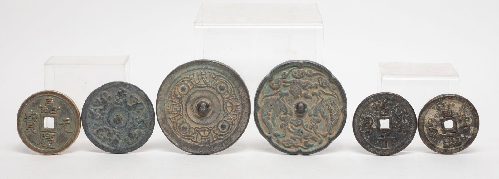 Estate Set Chinese Fengshui Coins, Bronze Mirrors: Set of four Chinese Fengshui coins and two bronze mirrors. Approx. 3.65 inch D (largest).