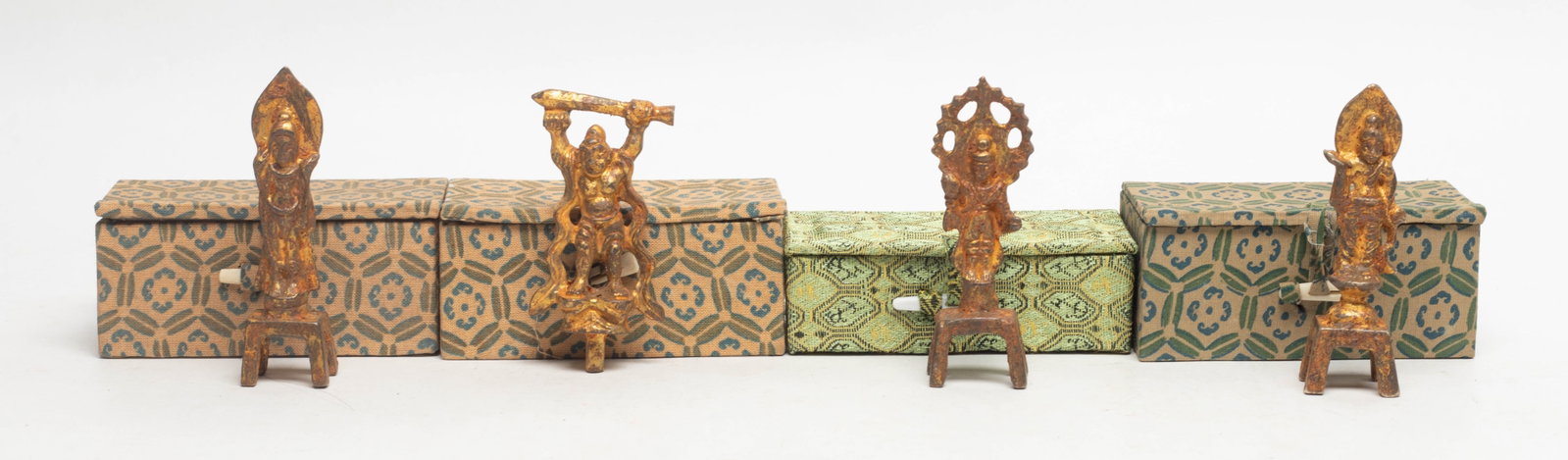Set Chinese Gilt Bronze Buddha Sculptures: Group of Chinese gilt bronze buddha, three mounted on a small four legged pedestal, each with box. 3.1*0.8 inch (larger)