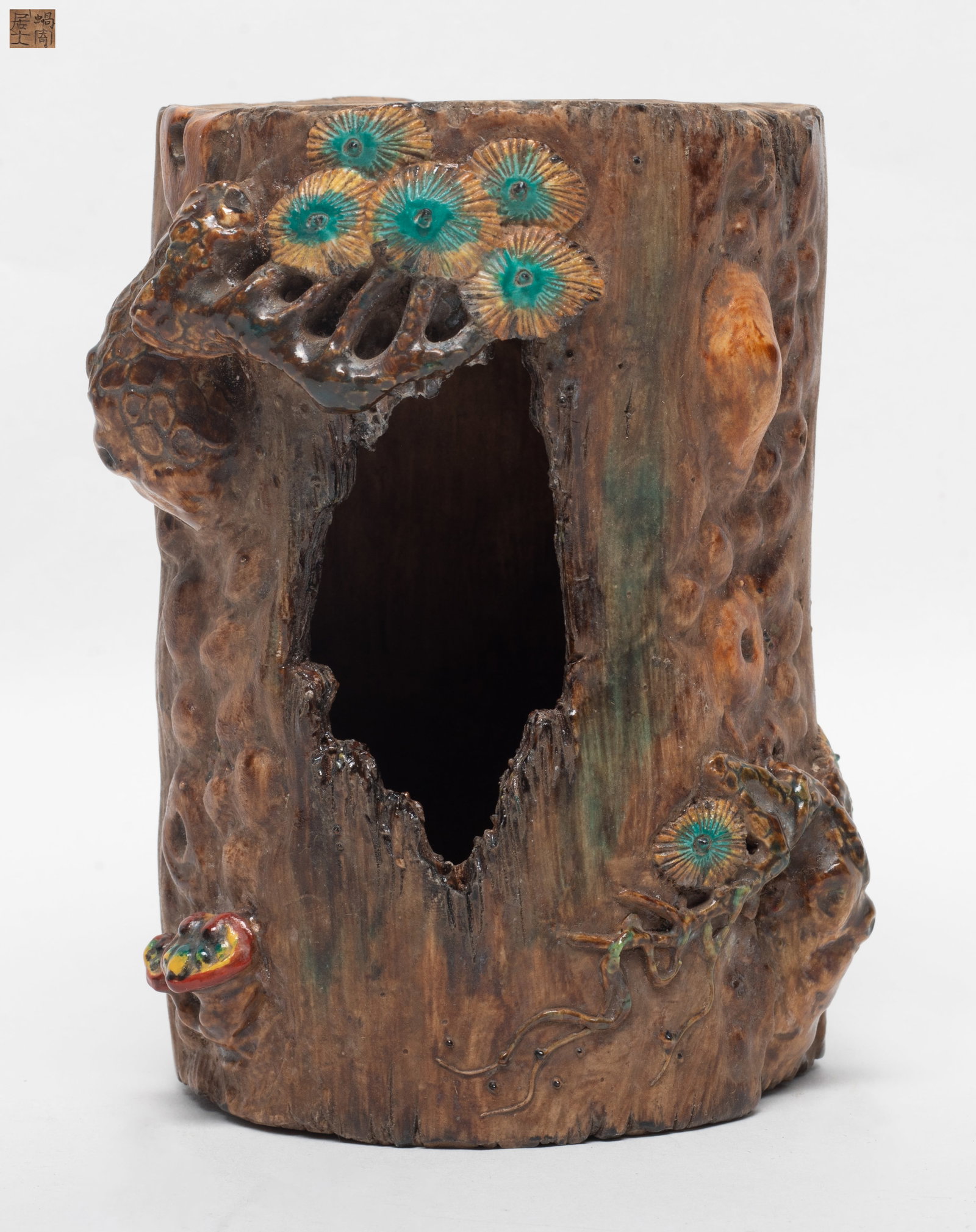 Unusual Chinese Porcelain Sculpture: The porcelain sculpture of the forest theme hollow tree trunk form, detailed with high relief toadstools, pine tree and a side opening, the base inscribed with a four-character. Approx. 5.6*3.5 inch