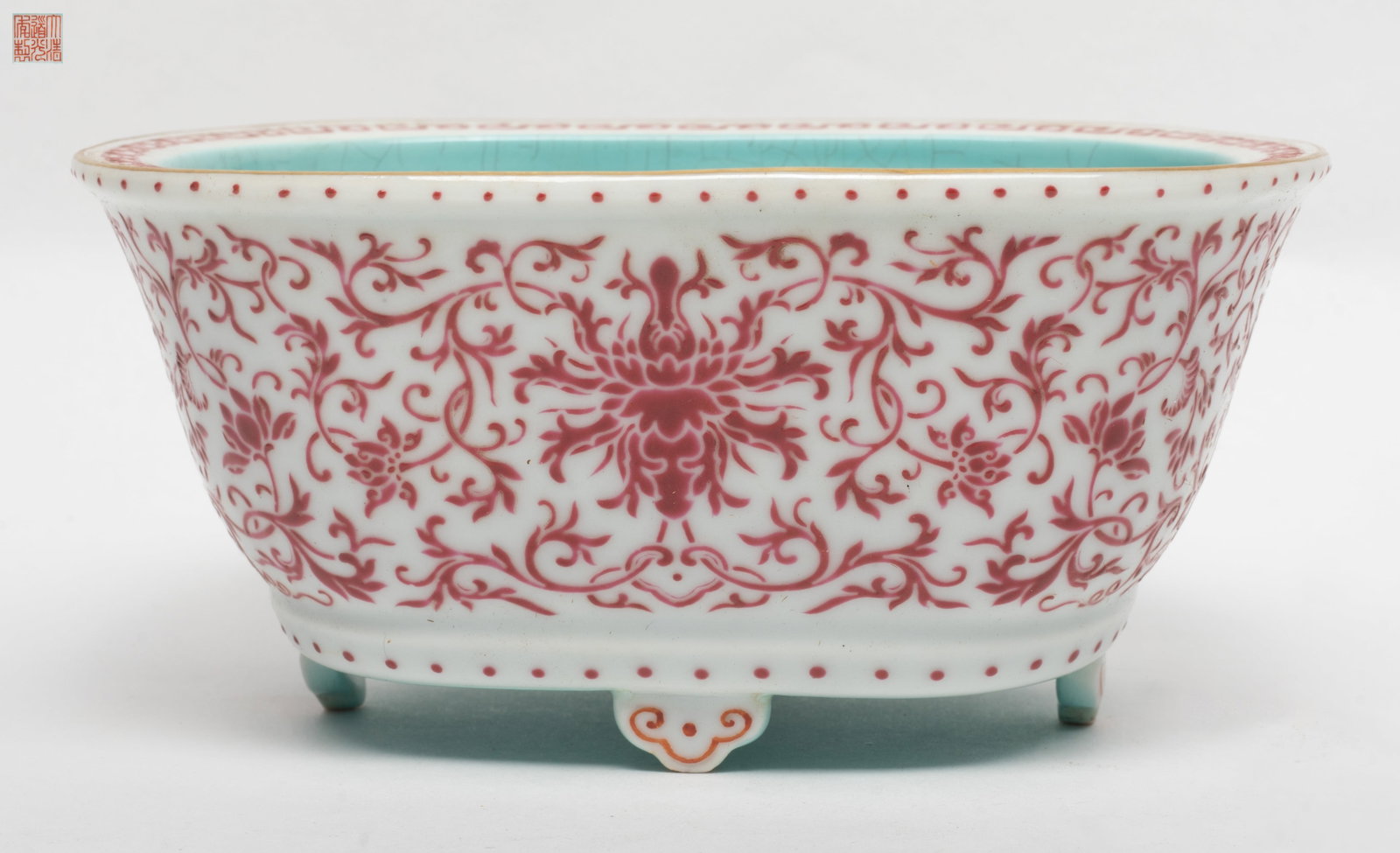 Chinese Export Enameled Porcelain Pot: Chinese export porcelain pot raised by four ruyi-head form feet, the exterior body painted with enameled floral pattern, the interior come with turquoise glaze, the base inscribed with a seal mark.