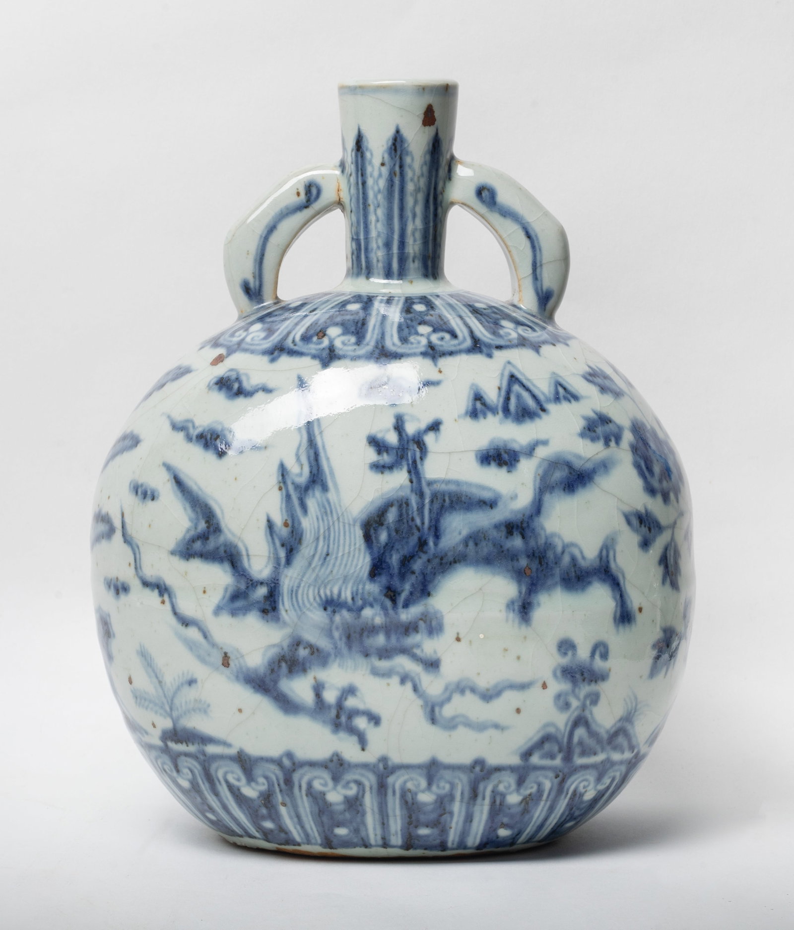 Chinese Blue & White Porcelain Vase: Of circular form with a slender neck flanked by a pair of curved handles, each side painted with dragon amidst clouds, the glaze crack and stop at the base. 10.6*8.1 inch