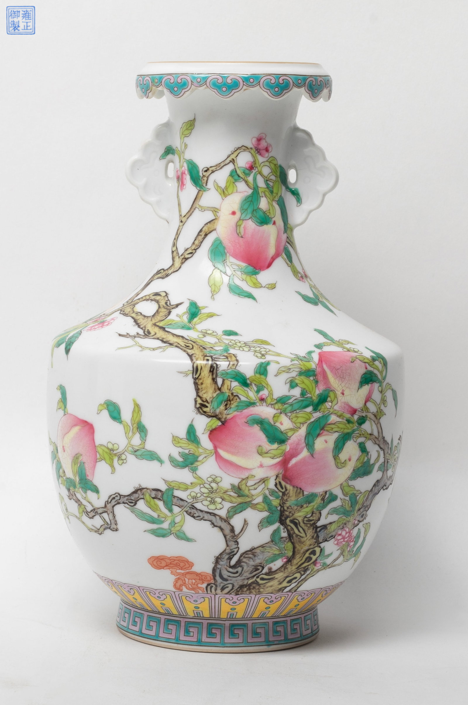 Estate Chinese Export Porcelain Vase: The exterior enameled and painted with iron-red bats and peach tree branches issuing flowers and large fruits, the base with a mark. Approx. 8.8*5.2 inch