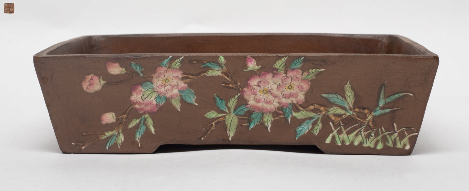 Chinese Enameled on Zisha Pot: Of rectangular form, both front and back enameled with blossom floral pattern, two sides decorated with butterflies, the base inscribed with a seal mark. Approx. 7.9*2.1 inch