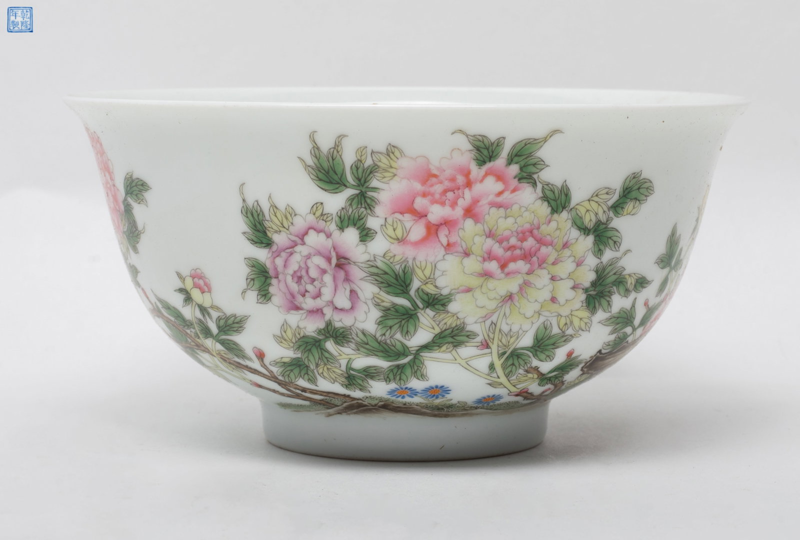 Estate Chinese Export Porcelain Bowl: The exterior decorated with pink and yellow tree peony blossom on a branching shrub, the base inscribed with a seal mark. Approx. 6.2*3.1 inch