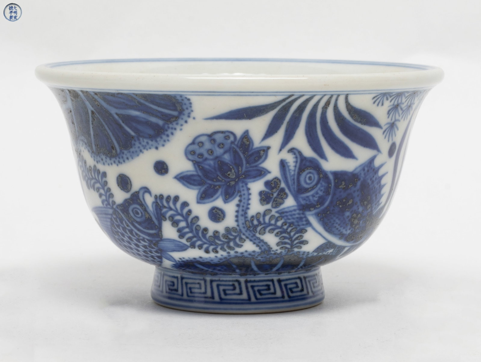 Chinese Blue & White Porcelain Tea Cup: Chinese blue and white porcelain tea cup, painted with fish and water plants in blue and white, the base inscribed with a six-character within double circle. Approx. 3.5*2.0 inch
