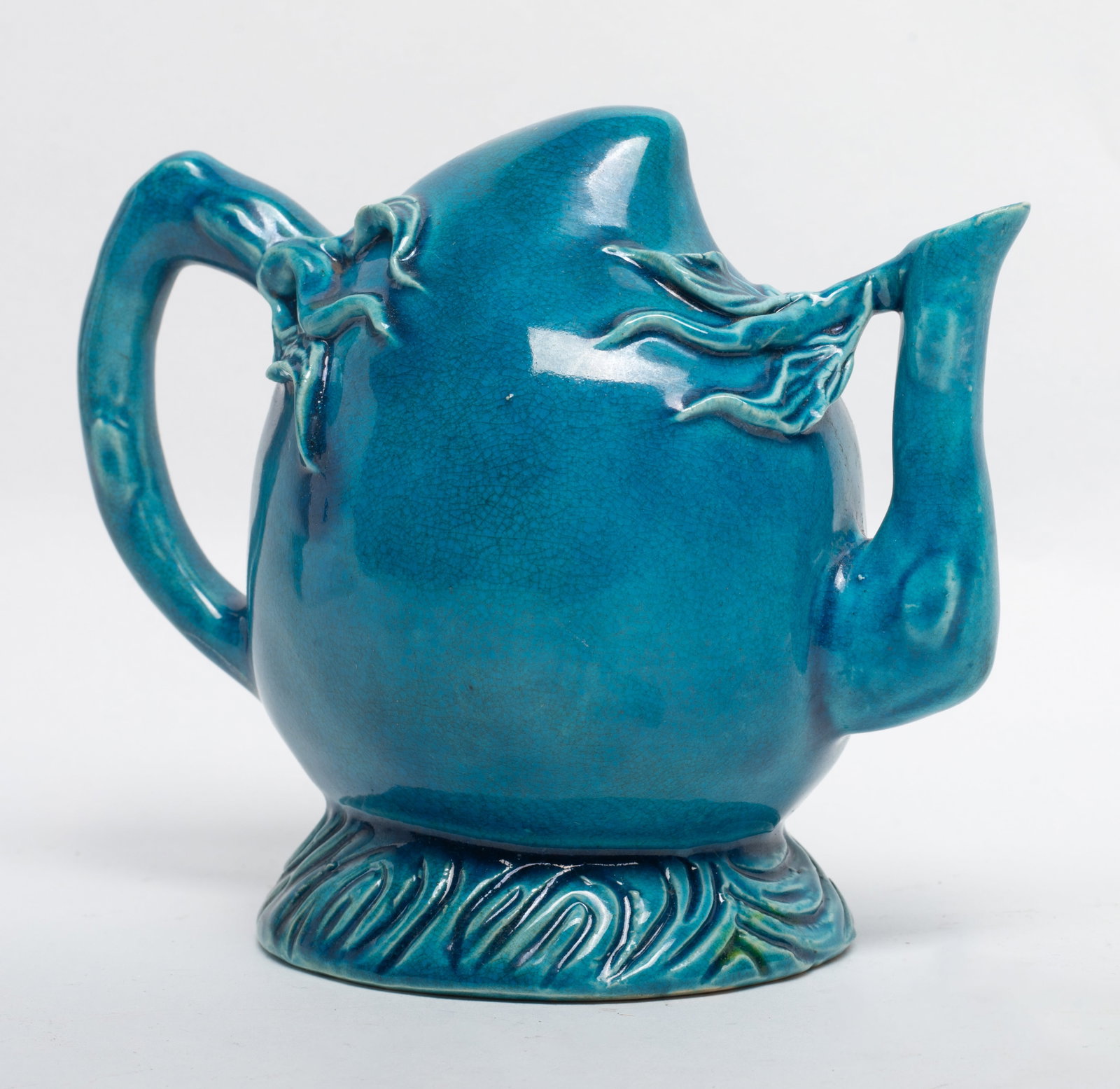 Chinese Turquoise Glazed Porcelain Pot: The body moulded in peach form, applied overall in turquoise glazed, the base pierced a aperture. 6.3*5.2 inch