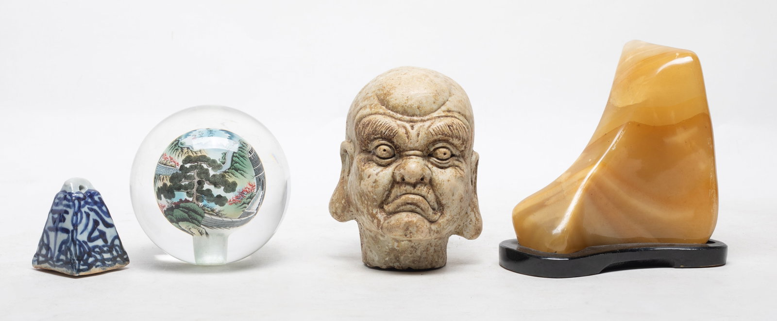 Chinese Scholar Stone, Glass & More: Including one well polished scholar stone, with stand, one glass ball, the inside painted with Great Wall pattern, one blue and white bell shape porcelain, and one figure sculpture. Size varies.