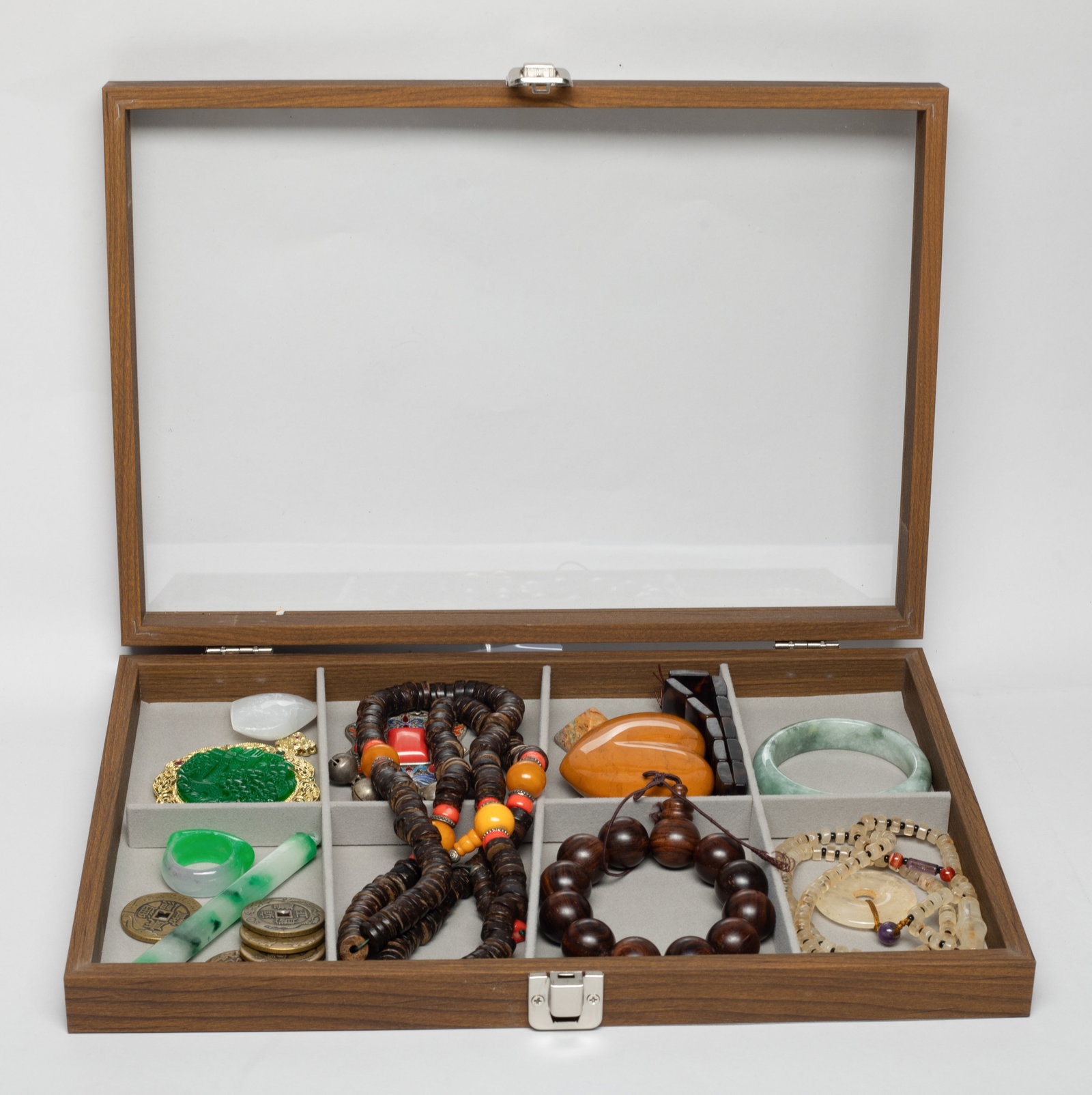 Estate Set Chinese Export Jewelry: Including necklaces, pendants, coin form decors, bead bracelets, colored stone carvings, a thumb ring, a bangle, with case. Approx. 34 inch L (longest necklace).
