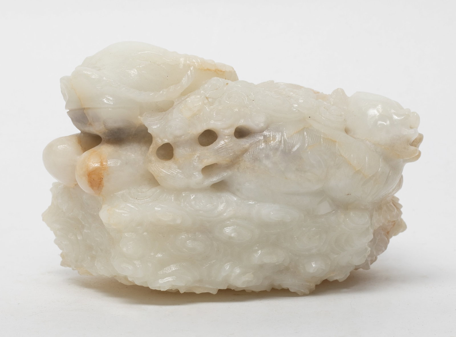 Large Chinese Cream White Jade Sculpture: Large Chinese cream white jade sculpture, carved in the form of recumbent buffalo resting on the base. Approx. 4.06*2.58 inch