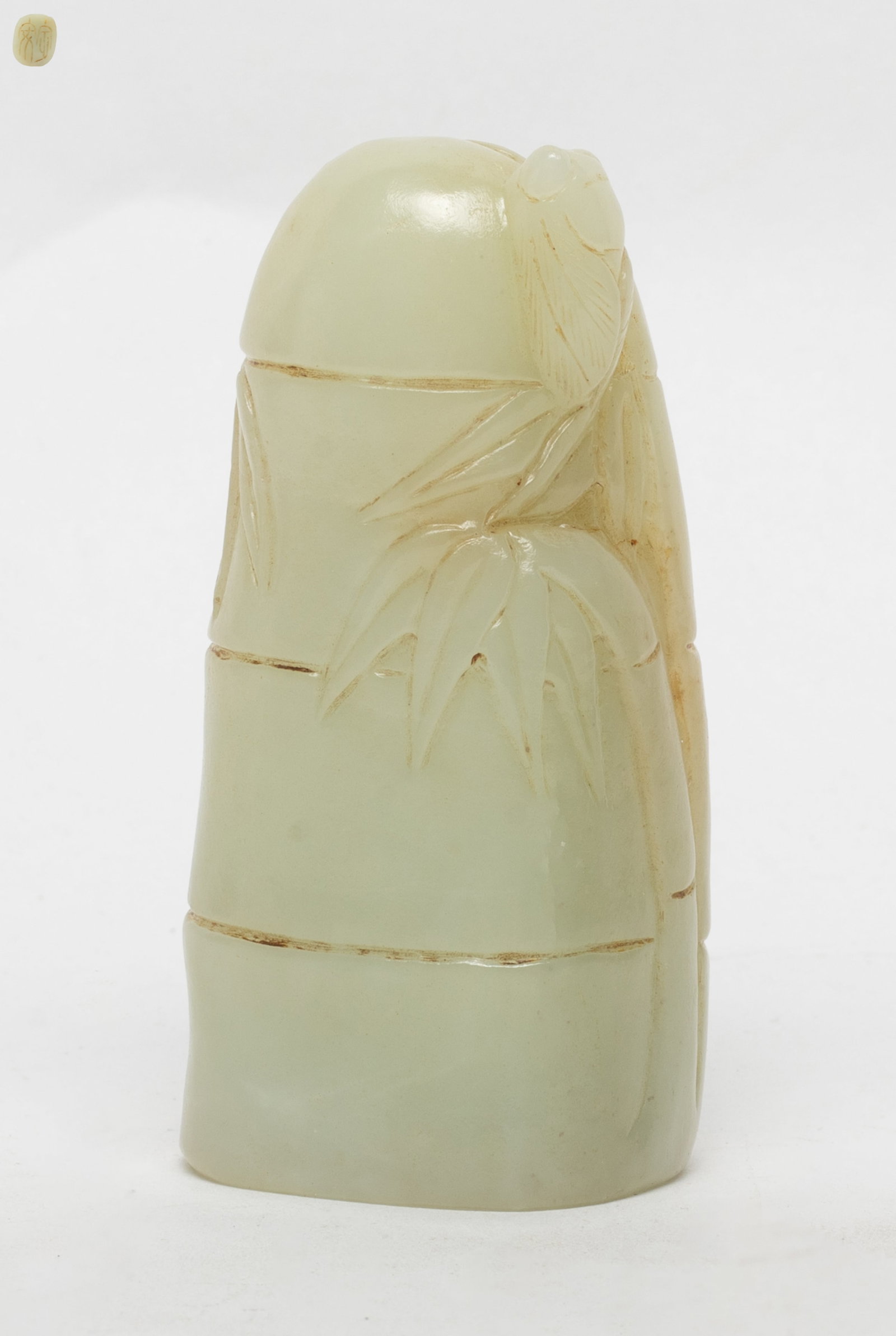 Chinese Jade Carved Seal: Chinese jade carved seal in the form of bamboo stem, detailed with bamboo leafy motif, the seal face caved with two character. Approx. 3.03*1.53 inch. Estate of the Store Closed Sale, DTLA.