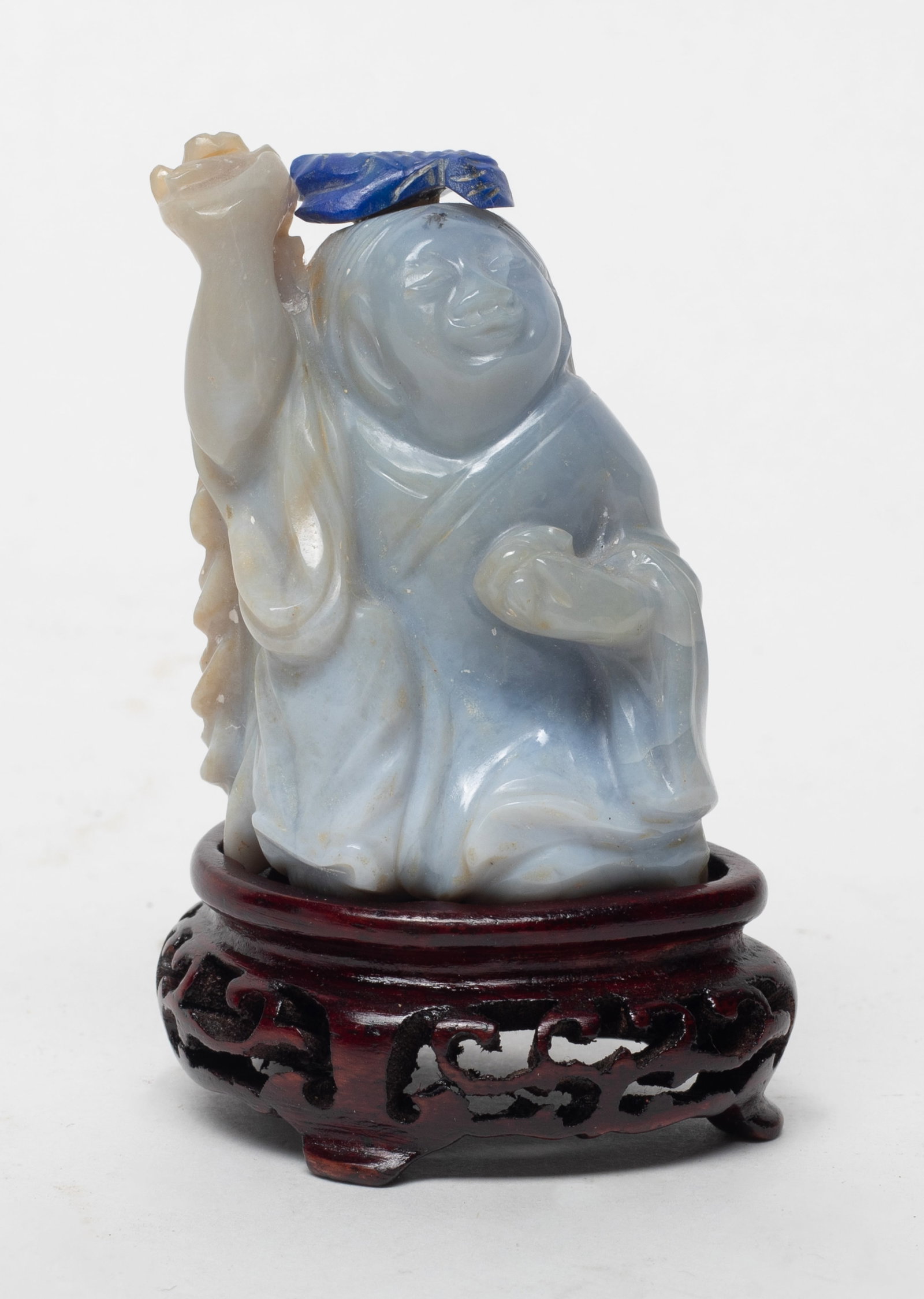Antique Chinese Cameo Agate Snuff Bottle: Chinese antique cameo agate snuff bottle, in the form of scholar, one hand raising and carrying cash coins, with stopper, and wood stand. Approx. 2.07*1.44 inch (w/o stand)