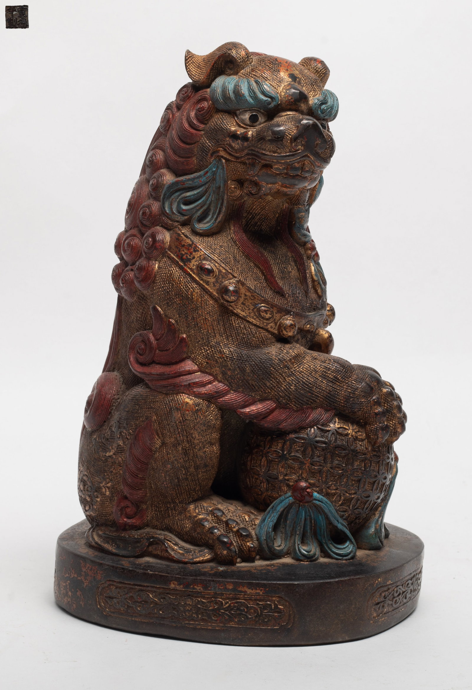 Estate Chinese Painted Bronze Foo-dog: Finely-casted bronze foo dog, the open mouth carrying a long ribbon, the front left paw on a hollowed ball. Approx. 10.2*6.3 inch