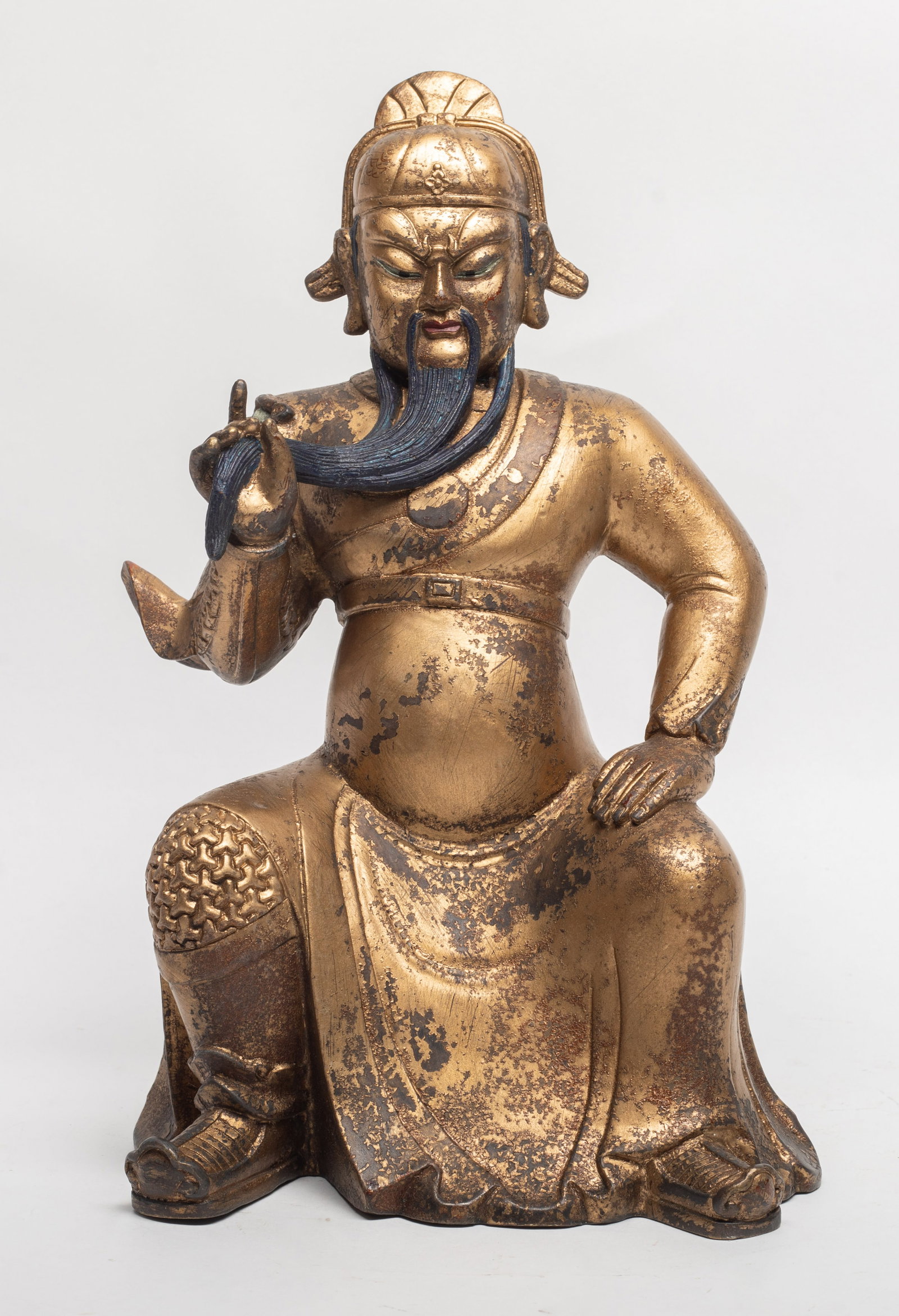 Chinese Gold on Bronze Sculpture of Kuandi: Chinese gold on bronze table sculpture carved as Kuandi wearing an armored robe. Approx. 11.2*7.2 inch