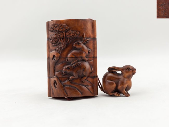 Antique Carved Box Wood Inro: Finely detailed carved antique box wood 4 case inro; detailed carved 1 pairs of rabbits playing beneath the trees with inlaid eyes, with a box wood netsuke carved as a rabbit with inlaid eyes and a bo