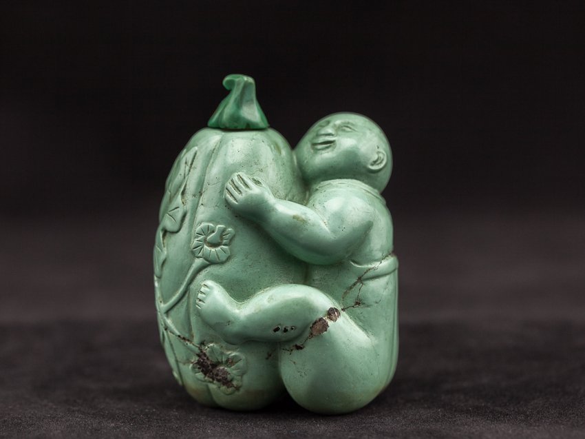 Chinese Antique Carved Turquoise Snuff Bottle: Large and heavy, turquoise carved snuff bottle with the design of a boy holding a wax gourd. This is a rare early 19th century subject. 7*5*4cm