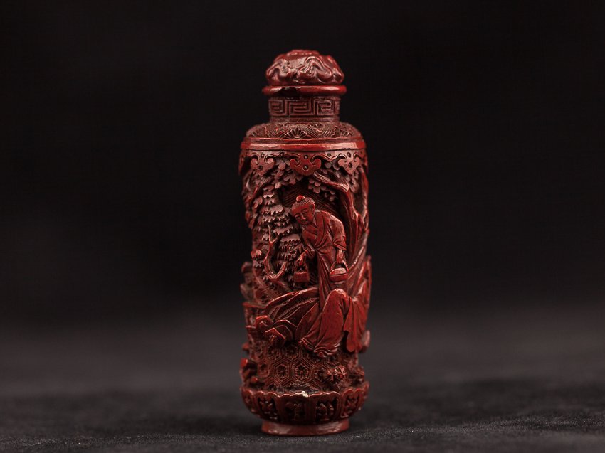 Chinese Antique Carved Cinnabar Lacquer Snuff Bottle: Rare and antique; cylindrical form; continuous design of men working in mountain. Special details, very rare. 18th century. From the estate of the Mr.Tazakula's family. 7.5cm high (with stopper)
