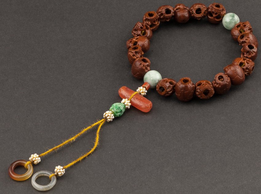 Chinese Antique Carved Nuts Prayer Beads: Rare and antique, carved nuts beads spaced by green jade beads. The main beads were carved to human skull shape. From the collector of Miura's family. Miura is a big family in Fukushima ken, Japan. Th