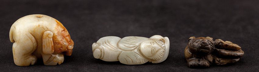 Group of Three Chinese Antique Ming Dynasty Jade: Group of three Ming jade pieces; black grey and yellowish jade mythical feline lying curled up, grayish color with brown-suffusion carved standing elephant with detailed paws, greenish color jade carv