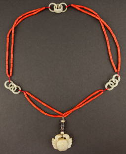 Chinese Antique Coral Necklace: Typical 19th century prayer beads, comprising of coral beads, spaced with three jade rings; a carved jade suspending on the item. around 1.3 cm bead length