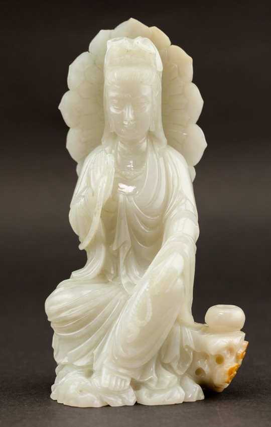 Chinese Antique 20th Jade Kuanyin: Antique Chinese jade; early 20th century export; of Kuanyin seated in a position of ease; nice and rare; right hand holds lotus shape behind the Kuanyin. Height: 17.5cm