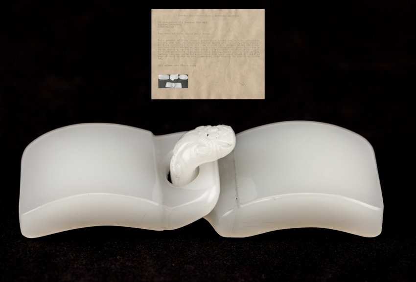 Chinese Antique Ming Glass Belt Buckle: Two pieces glass belt buckle in off white glass, no carving on body, the hook ending in a dragon's head. Both bases with plain circular stud.Ming Dynasty. Length:10.5cm Width:3.7cm