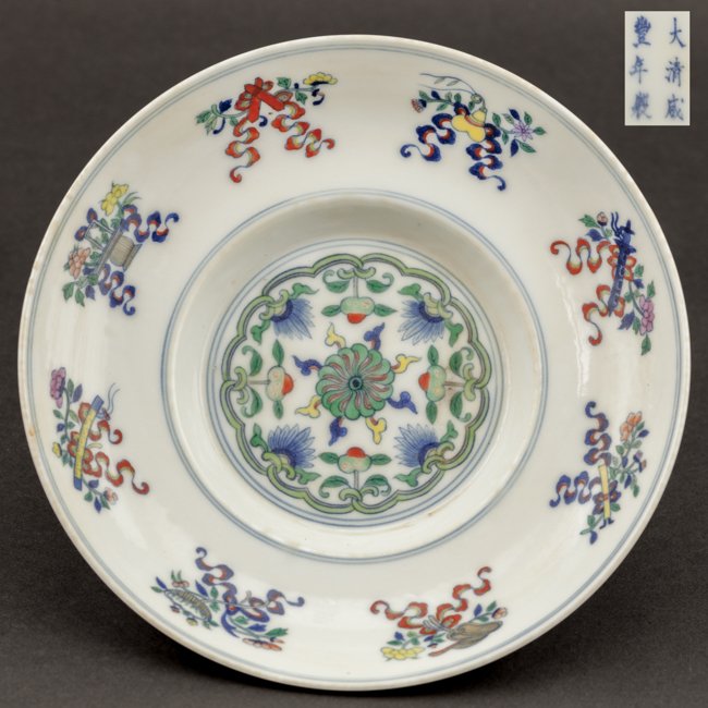 Chinese Antique Doucai Porcelain Dish: Chinese antique, Xianfeng mark and of that period; the circular form with an intricate lotus blossom to the interior and exterior; with foot stand; Diameter: 20.57cm Depth: 4.57cm