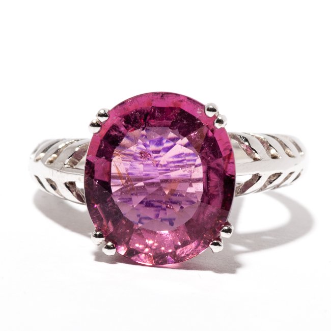 Tourmaline Ring: Chinese 14K white gold, tourmaline and diamond ring, centering a highly translucent, faceted oval cushion-cut pink tourmaline, with small rows of pave diamond. Weight 6.01 G. Size 7.