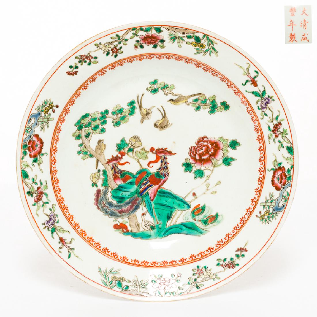 Chinese Antique Famille Rose Porcelain Dish, Qing: Painted to the interior with a central foliate panel enclosing a perched on a flowering branch and birds in flight, encircled by a four cartouches depicting peonies, the base with Xianfeng mark. 8.9 i