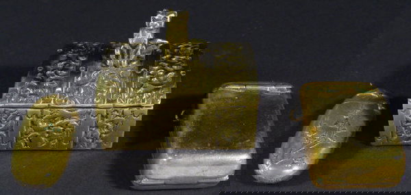 Three novelty brass vesta cases in the form of a t: Three novelty brass vesta cases in the form of a treasure trunk mounted with a cat, an aesthetic oval case decorated with birds and peony flowers and a rectangular photo frame design case with glass p