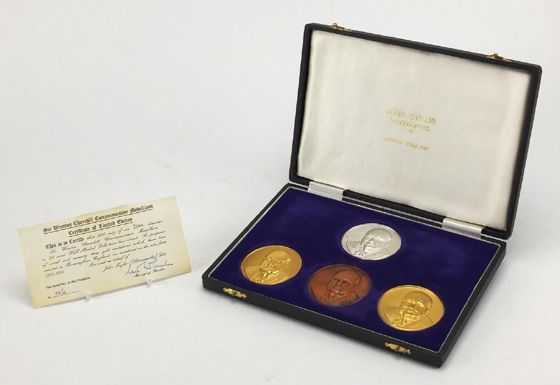 Four Sir Winston Churchill commemorative medallions: Four Sir Winston Churchill commemorative medallions comprising one in 22ct gold, one silver gilt, one silver and one bronze, limited edition 106/500 by John Taylor, each medallion 5.8cm in diameter, t